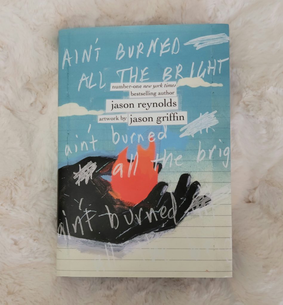 The book Ain't Burned All the Bright by Jason Reynolds with artwork by Jason Griffin